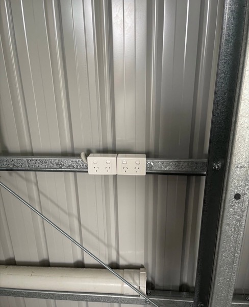 A power point mounted on the steel frame inside a shed