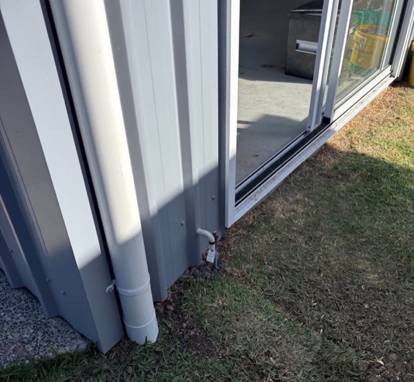 Conduit running along the outside wall of a house