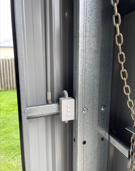 A junction box mounted on a steel post