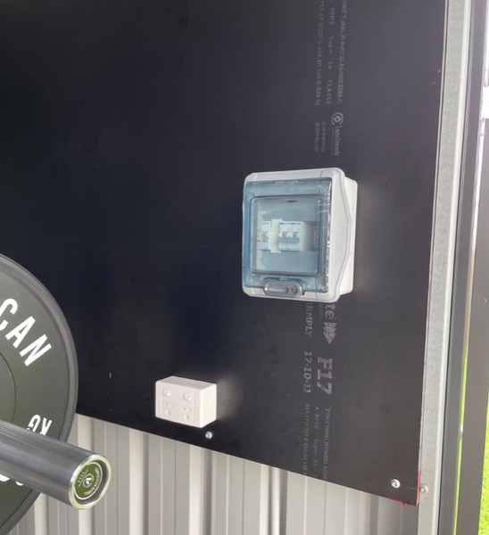 An isolator switch mounted on a dark wall